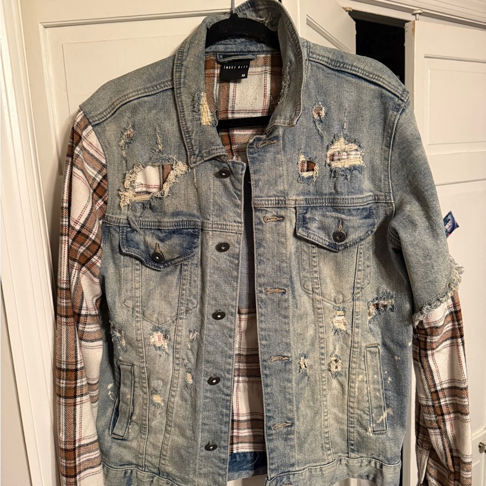 Distressed Denim Jacket with Plaid Sleeves